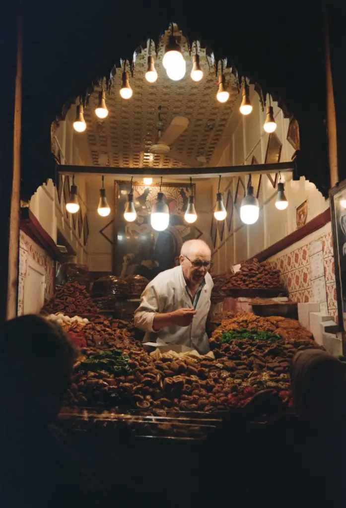Market seller preparing goods in a shop