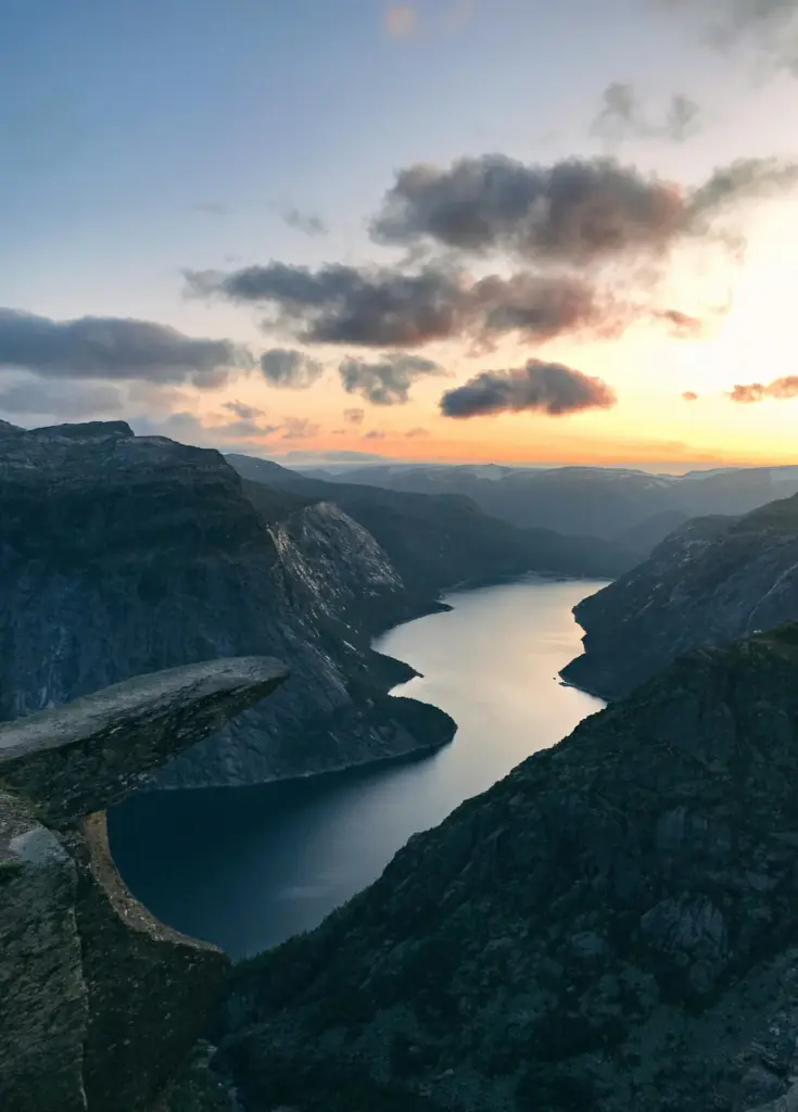 Mountain-lined fjord at sunset