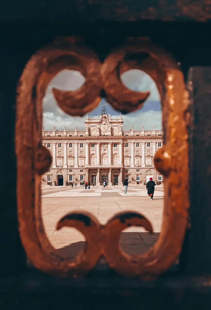 Ornate building seen through a brick arch