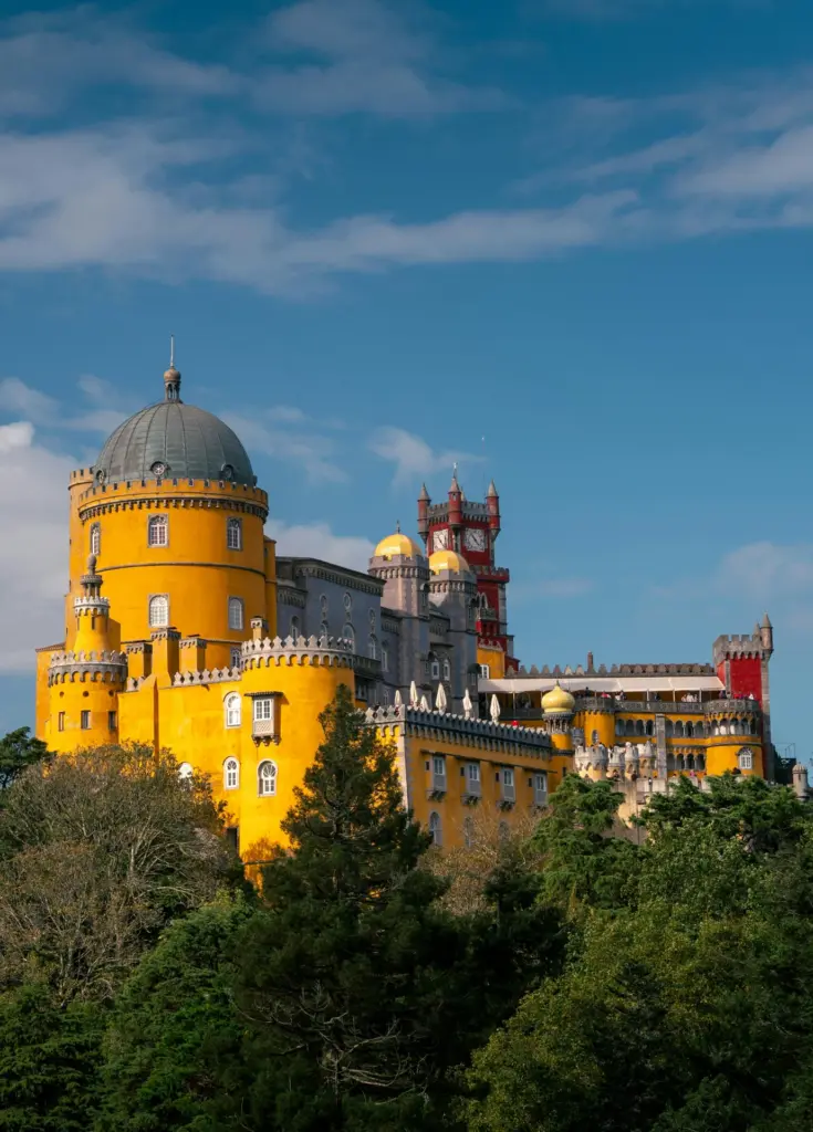 Colorful palace towers on a wooded hill