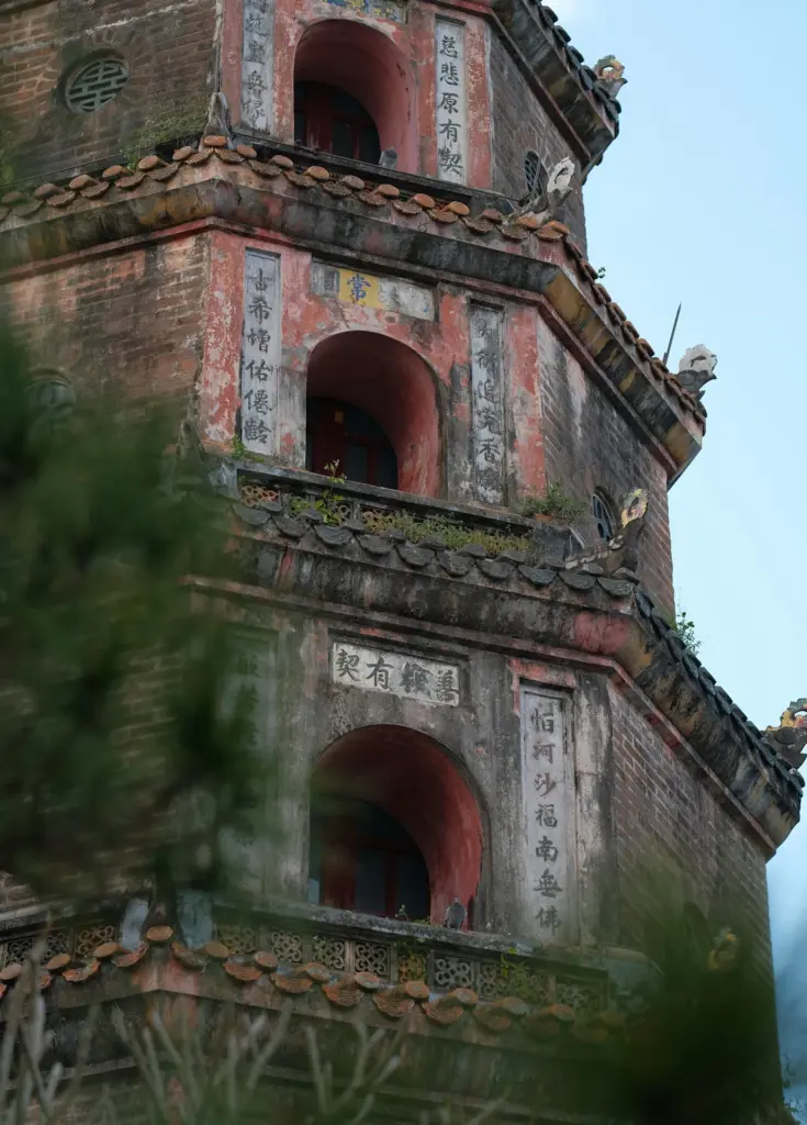 Old stone building surrounded by vegetation